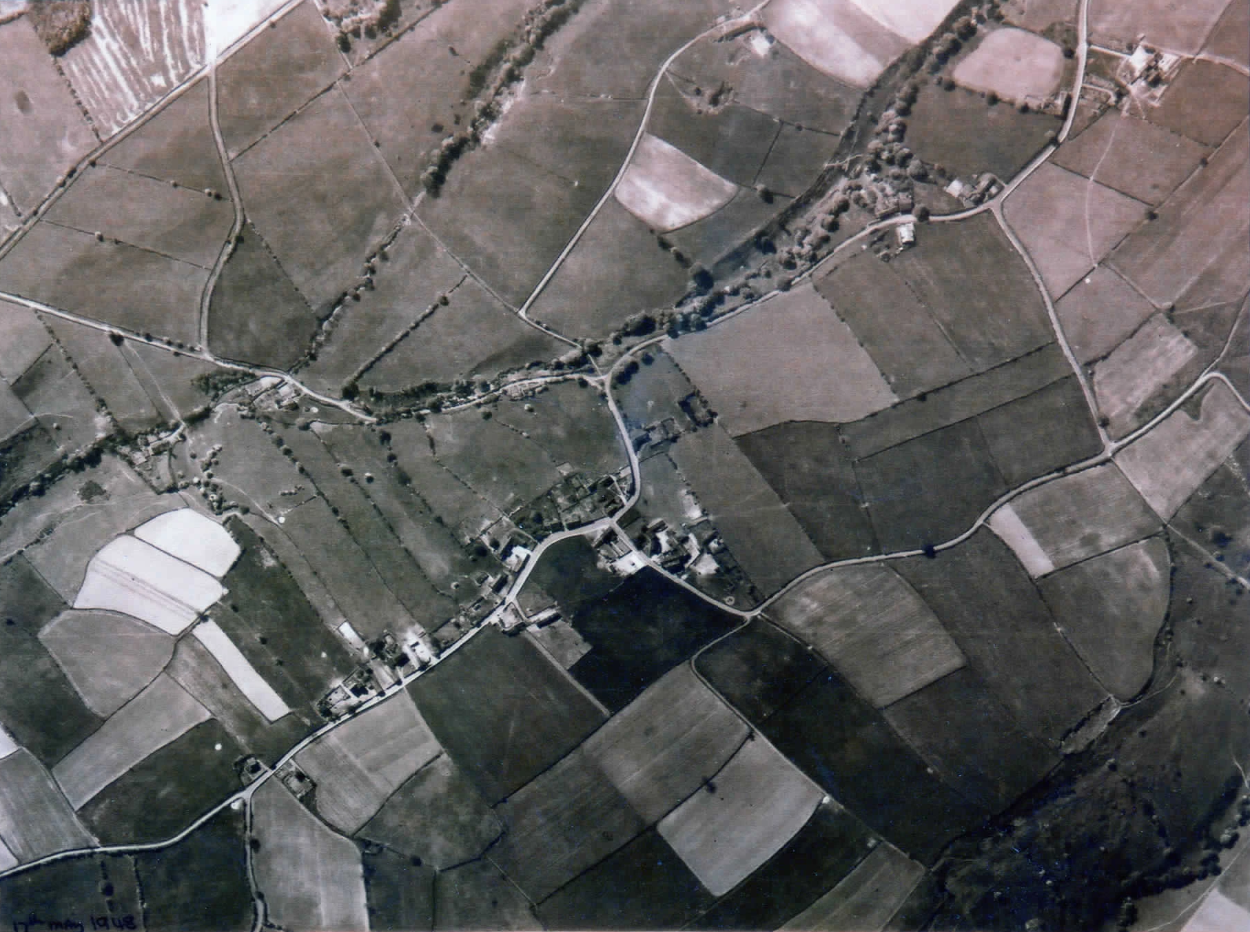 Aerial photograph of Briestfield showing fields, winding roads and clusters of buildings.